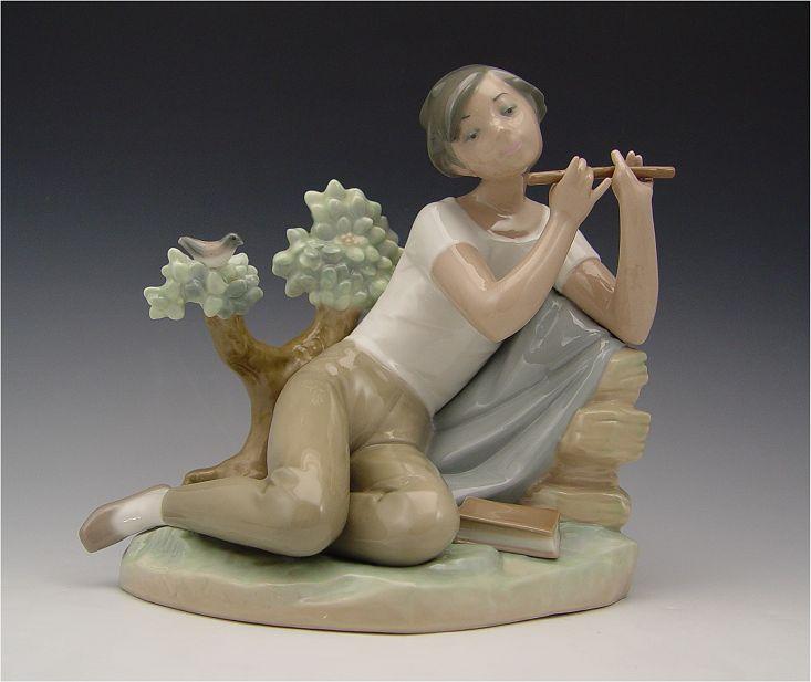 RETIRED LLADRO STUDENT FLUTE PLAYER