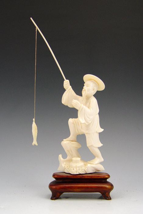 CHINESE CARVED IVORY FIGURE OF A FISHERMAN: