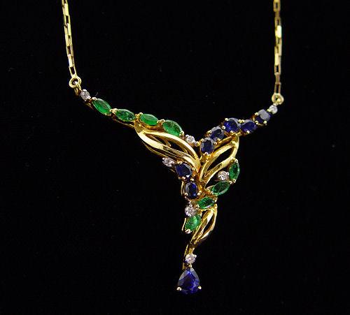 AN EYE CATCHING EMERALD, SAPPHIRE,