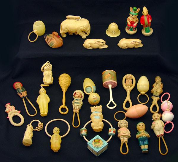 COLLECTION OF CELLULOID BABY RATTLES