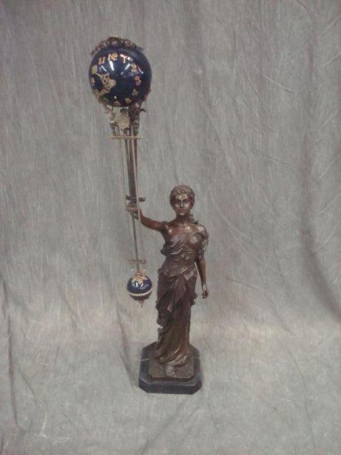 Female Figural Gilt Metal Wag Clock.