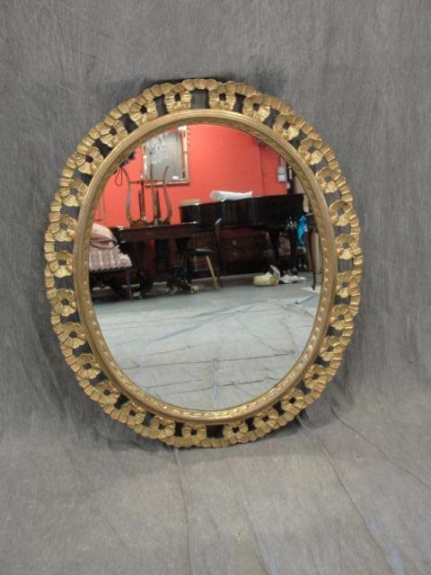 Giltwood and Carved Oval Mirror.