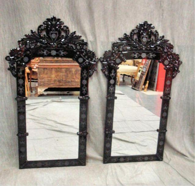 Pair of Black Venetian Mirrors.