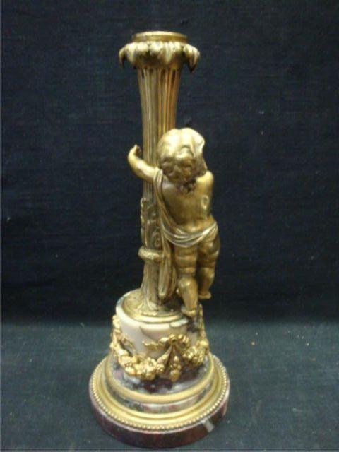 Gilt Bronze and Marble Figural Candlestick.