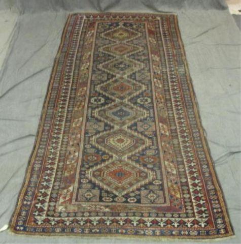 Antique Kazak Carpet. Has some wear