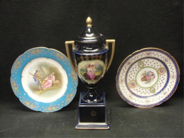 Lot of Porcelain: an Urn and Two Plates.