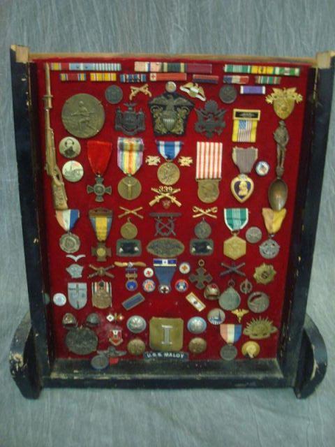 Collection of Medals in Display Case.