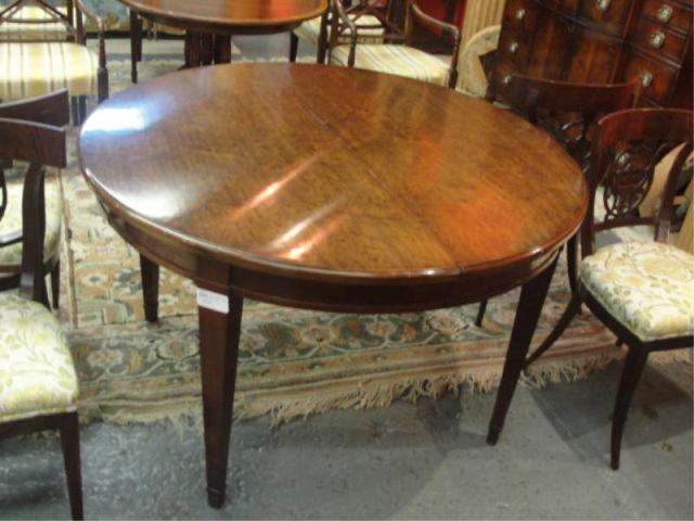Round Dining Table with 1 Large Leaf.