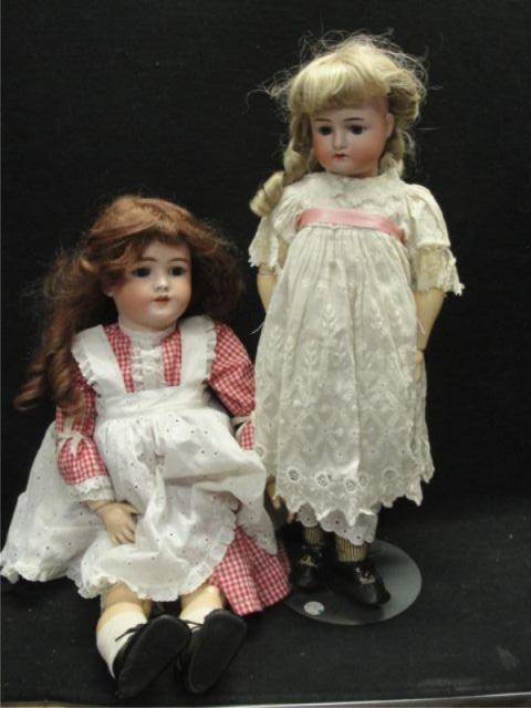 Two Porcelain Head Dolls. One is