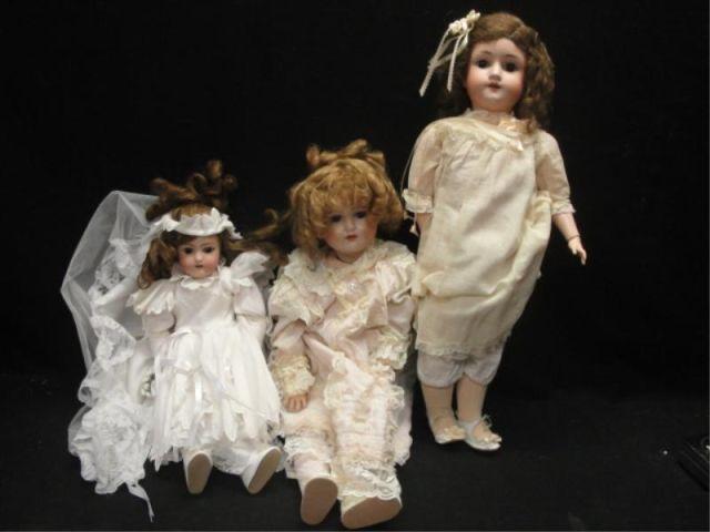 Three Porcelain Head Dolls. As