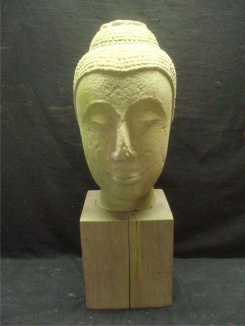 Stone Buddha Head on a Wood Base.