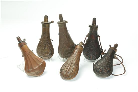 SIX BRASS POWDER FLASKS.  One by Ames