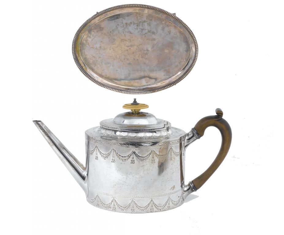 A GEORGE III BRIGHT CUT OVAL TEAPOT