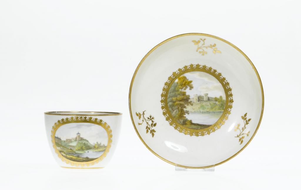 A RARE PINXTON TEACUP AND SAUCER
of