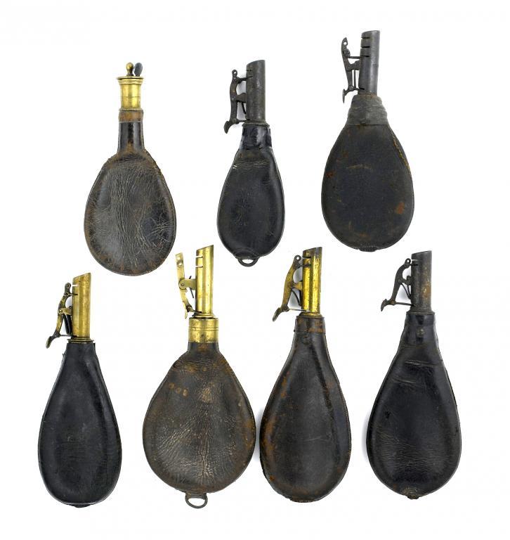 SEVEN VICTORIAN LEATHER SHOT FLASKS
with