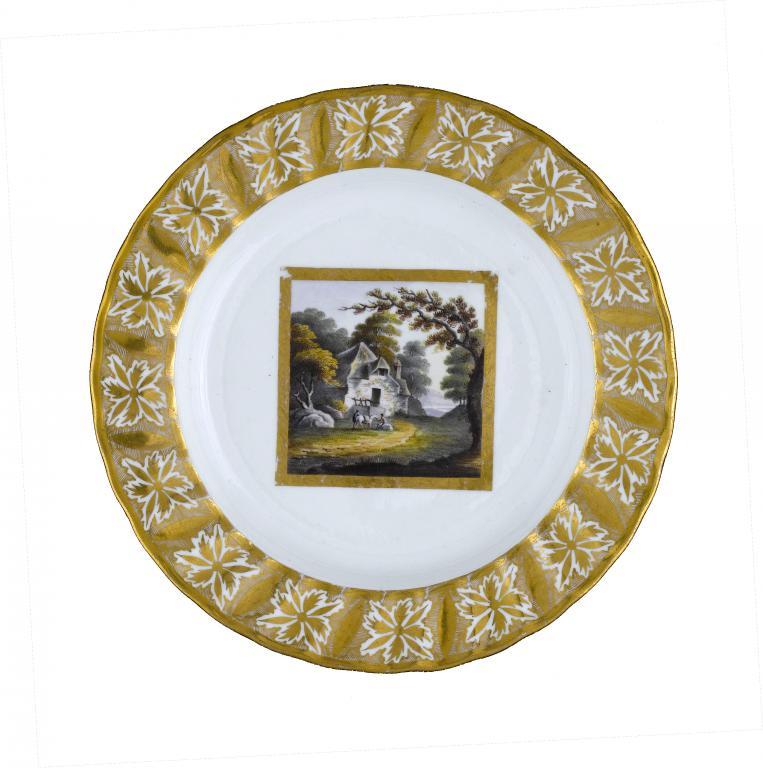 A DERBY PLATE 
painted with rustics