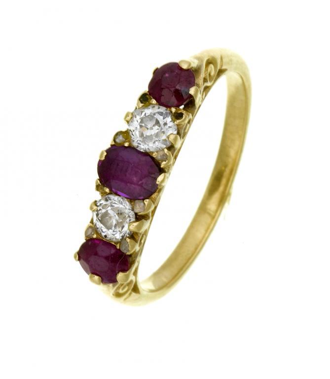A RUBY AND DIAMOND FIVE STONE RING
with