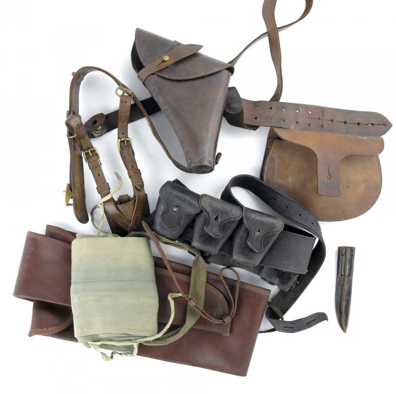 A LEATHER PISTOL HOLSTER AND BELT,