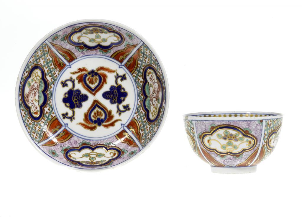 A CHELSEA DERBY TEA BOWL AND SAUCER enamelled 10967e