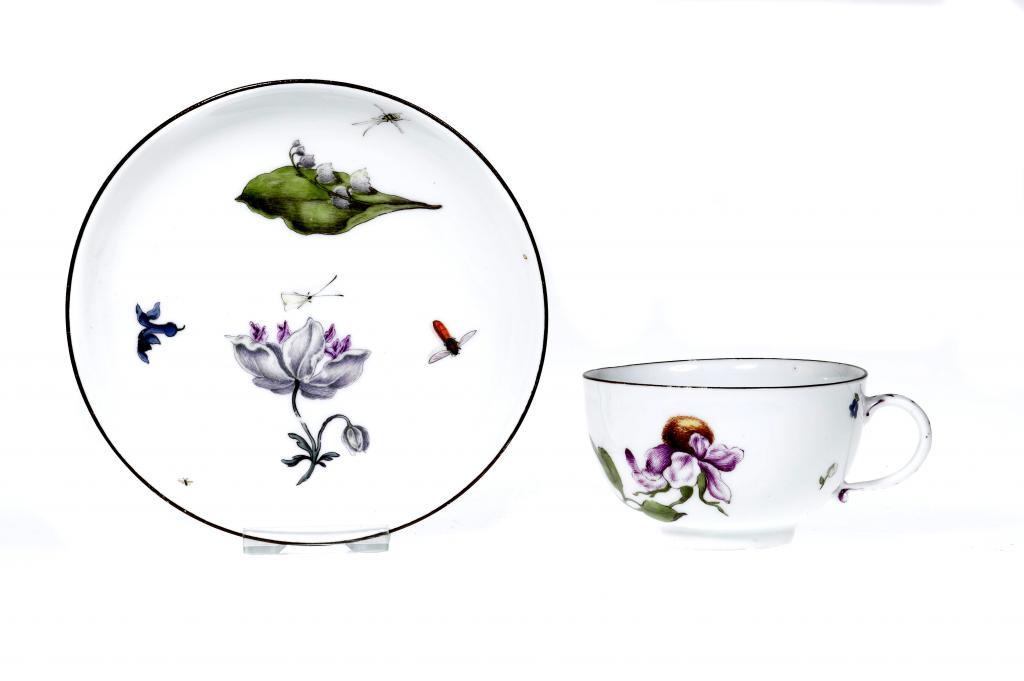 A MEISSEN TEACUP AND SAUCER
enamelled