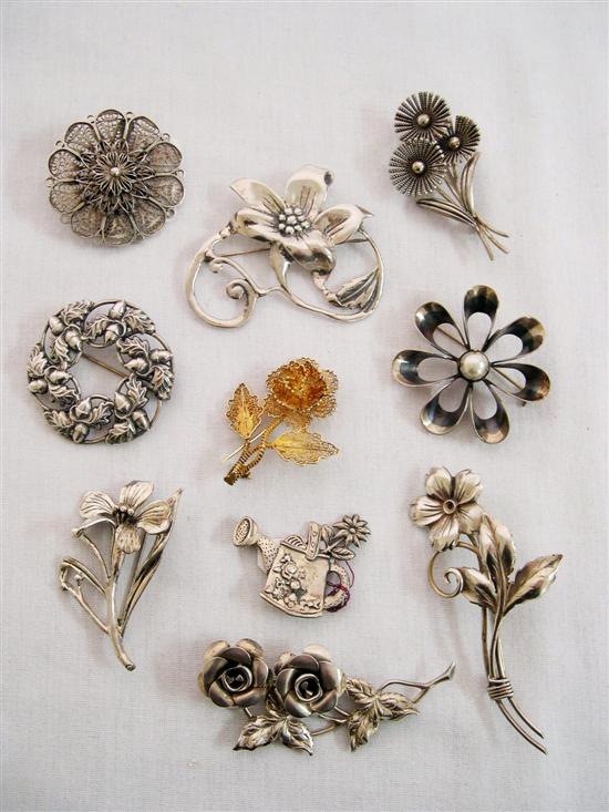 Sterling silver pins including nine
