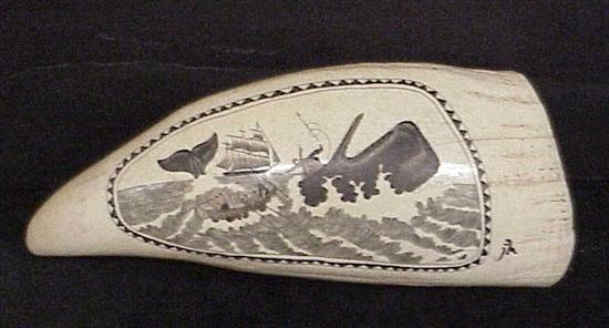 Scrimshaw whales tooth depicting whaling