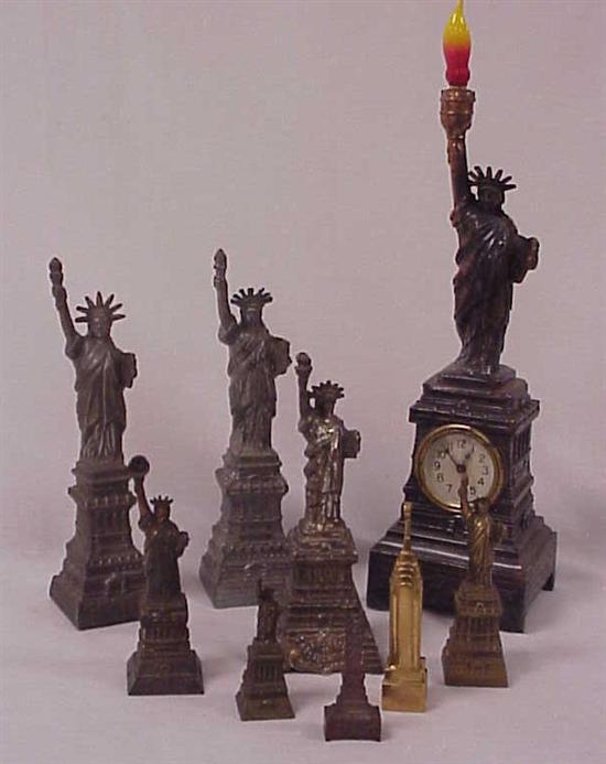 Group of eight assorted sized Statue