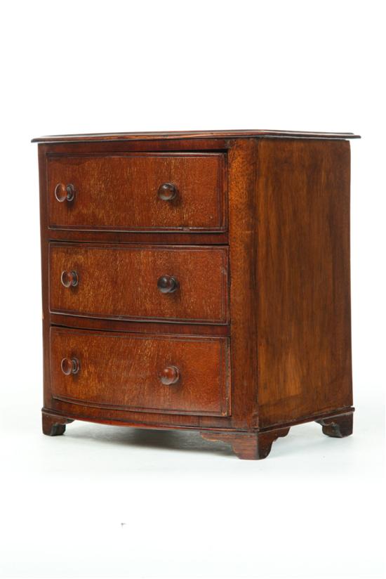 MINIATURE BOWFRONT CHEST OF DRAWERS.