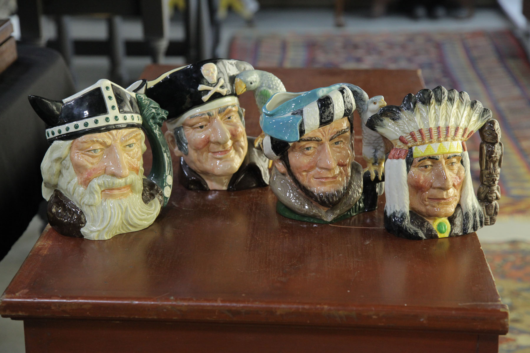 FOUR ROYAL DOULTON FIGURE MUGS.