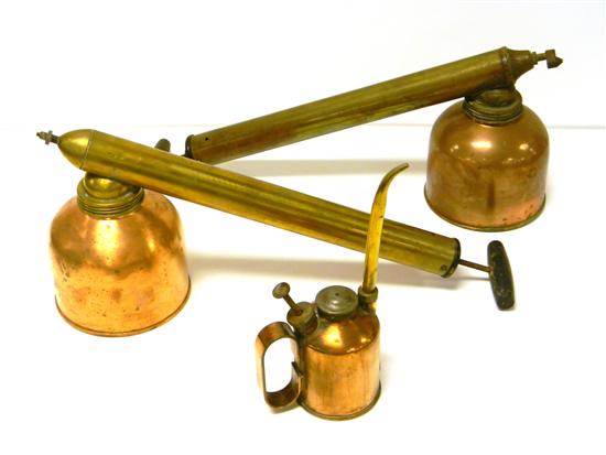Two brass and copper Blizzard sprayers;
