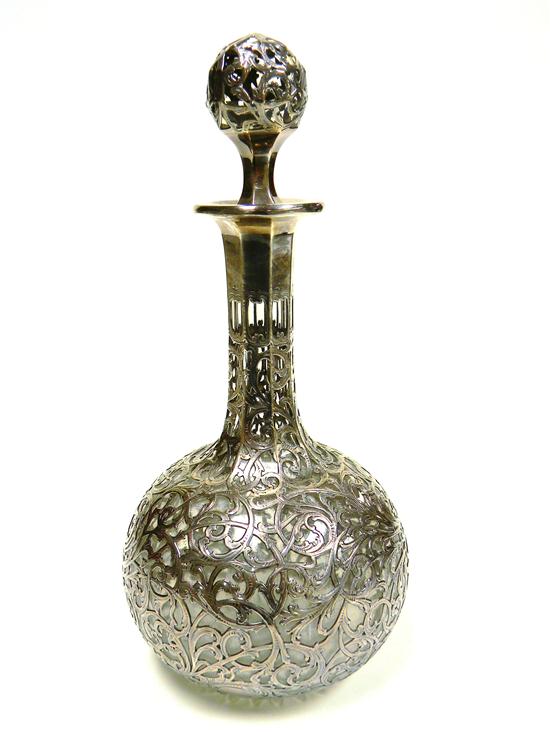 Glass decanter with elaborate silver
