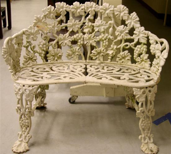 Cast iron garden settee with elaborate 10a67f