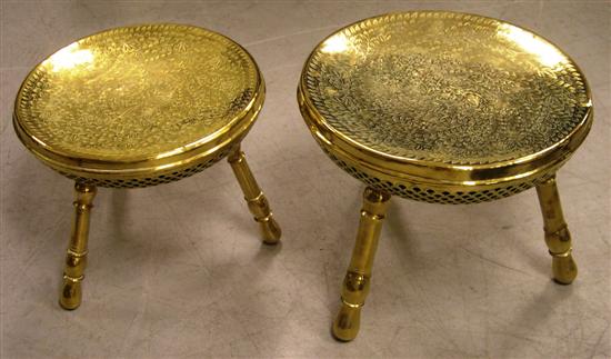 Two Eastern brass stools  chased