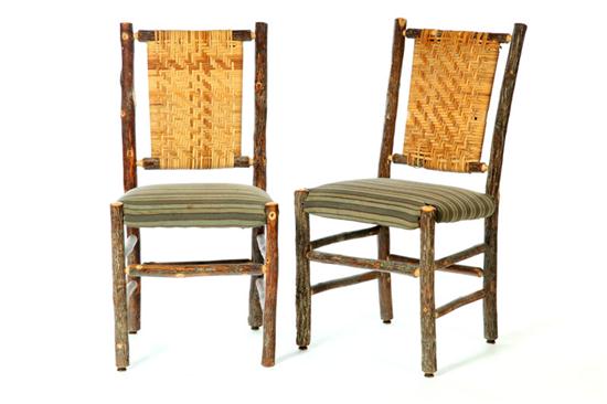 SET OF FOUR RUSTIC SIDE CHAIRS.