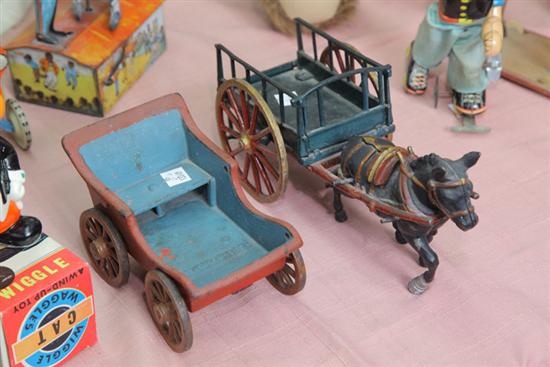 TWO CAST IRON TOYS DONKEY PULLING 10ac59