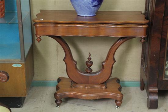 TILT TOP GAME TABLE. Walnut having a