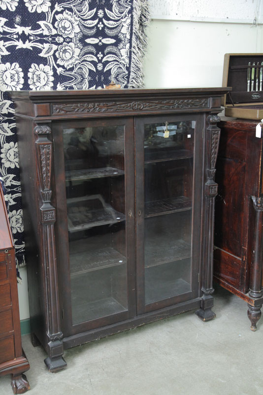 BOOKCASE. Mahogany with a molded and