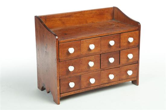 TABLE-TOP CHEST OF DRAWERS.  American