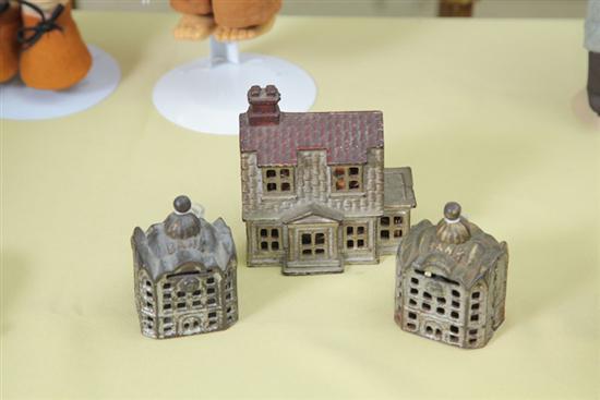 THREE CAST IRON BUILDING BANKS. House