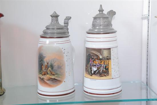 TWO STEINS. White porcelain steins with