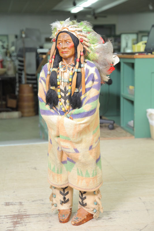 LARGE SKOOKUM CHIEF. Wearing beaded