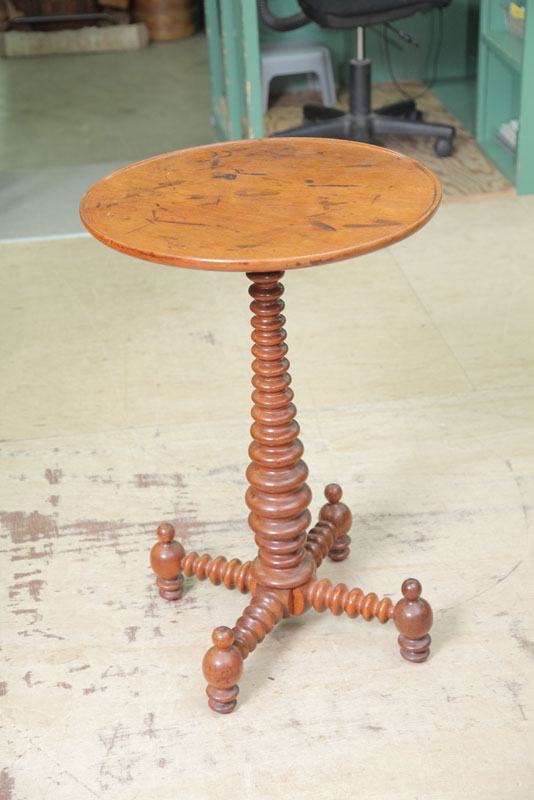 CANDLESTAND. Walnut having a circular