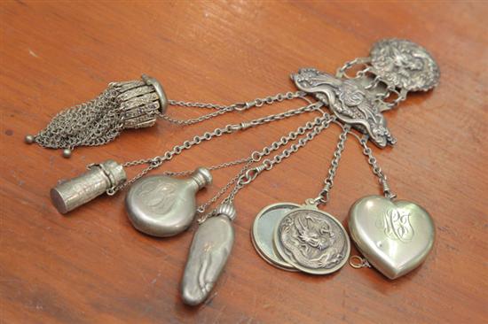 CHATELAINE. Silver chatelaine has