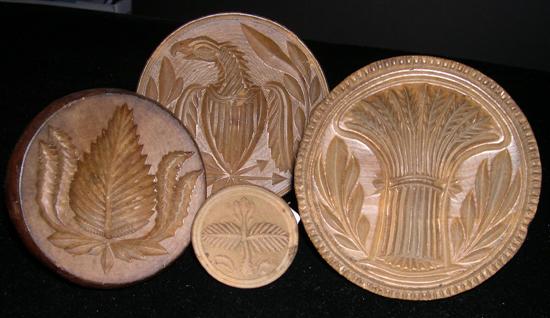 Four round wooden butter stamps