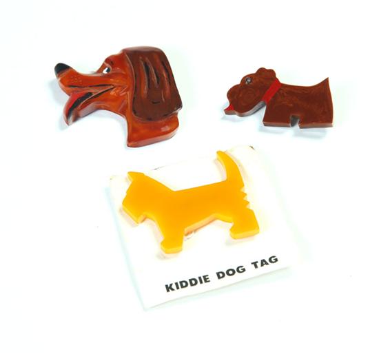 THREE EARLY PLASTIC DOG PINS  1115ee