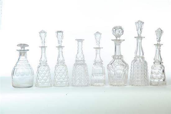 EIGHT EARLY GLASS DECANTERS.  American