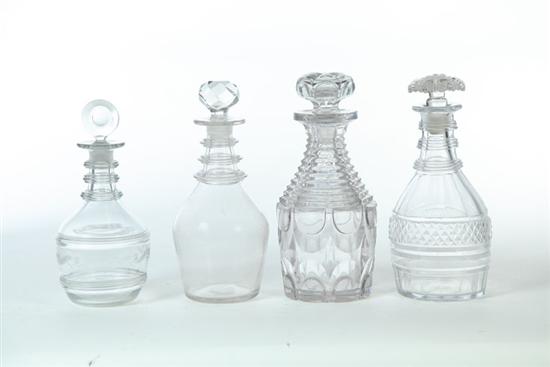 FOUR DECANTERS.  Engraved blown decanter