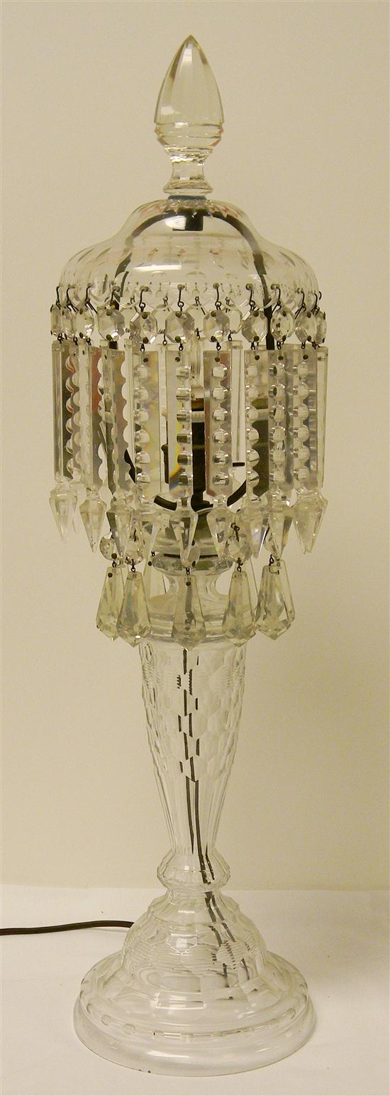 Cut glass lamp with faceted prisms