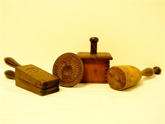 Woodenware: two butter presses  one