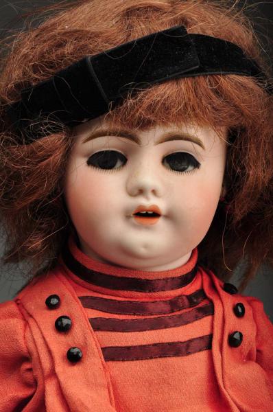 French Bisque Walking Doll. 
Description